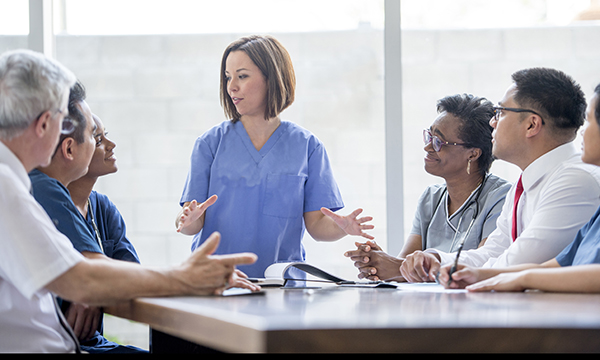 Medical professionals discussing cost-effective strategies