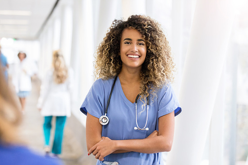 A nurse with curly hair