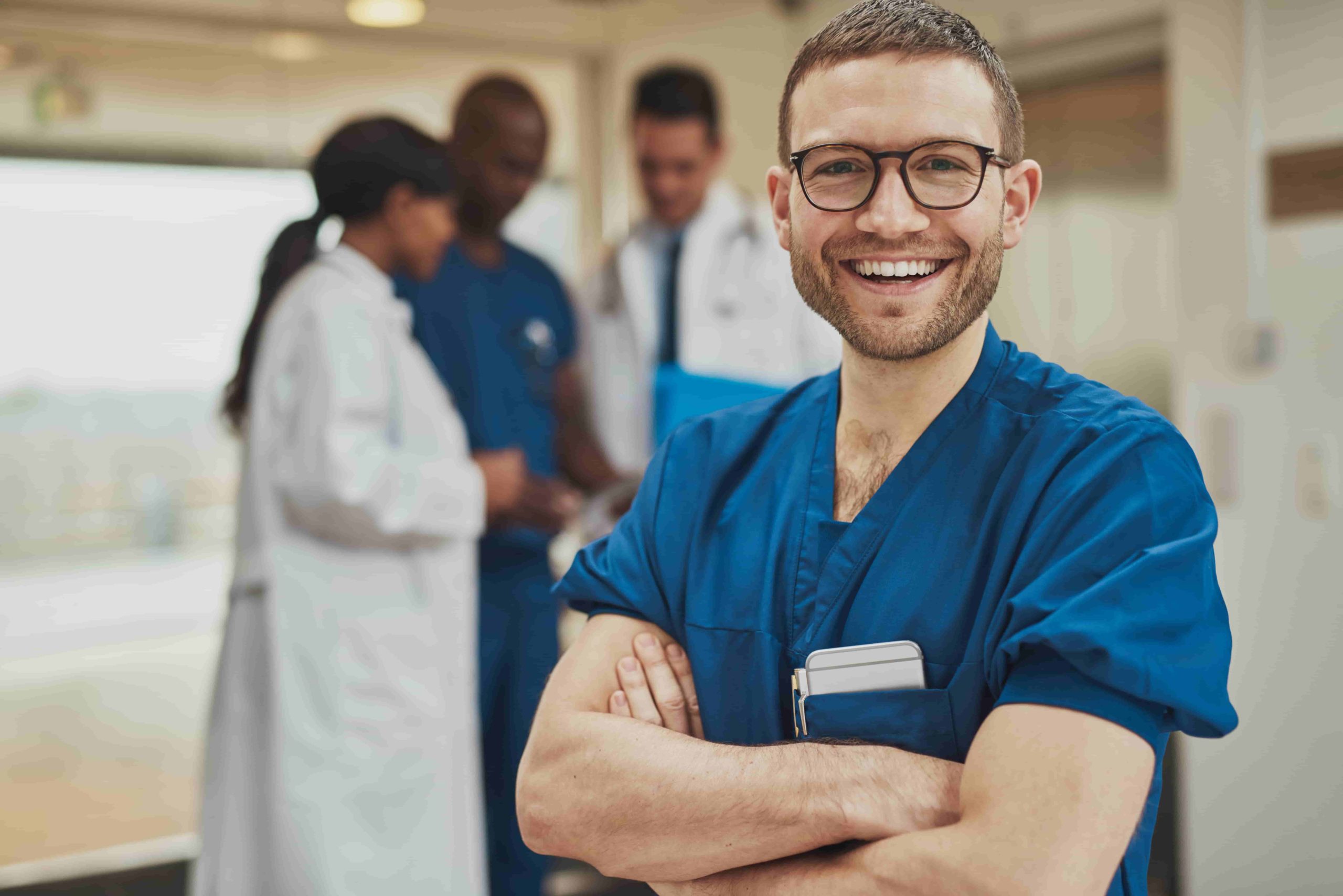 A medical professional in scrubs